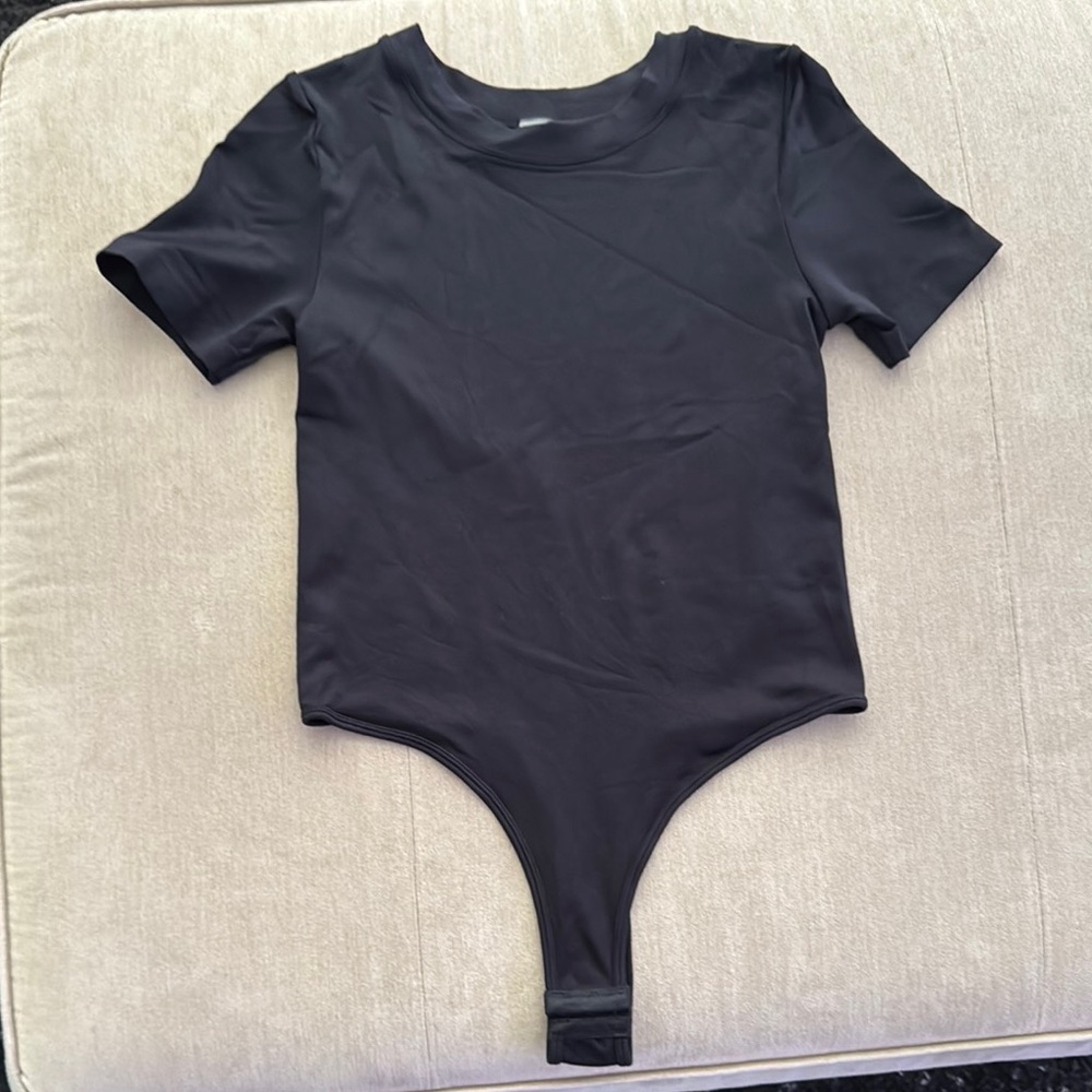 NWOT Black One Piece Bodysuit